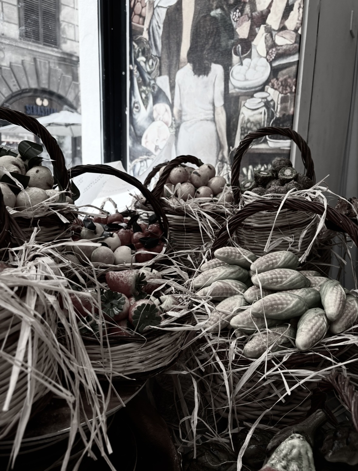 Frutta Martorana sweets displayed in baskets in a pastry shop in Palermo